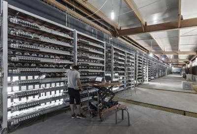 A mining farm with rows of mining rigs