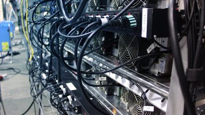 A large-scale cryptocurrency mining farm operating in a Canadian province known for its hydroelectric power.