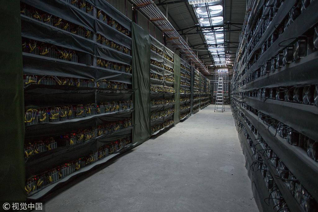 A GPU mining rig humming with activity, showcasing the dedicated hardware required for cryptocurrency mining.